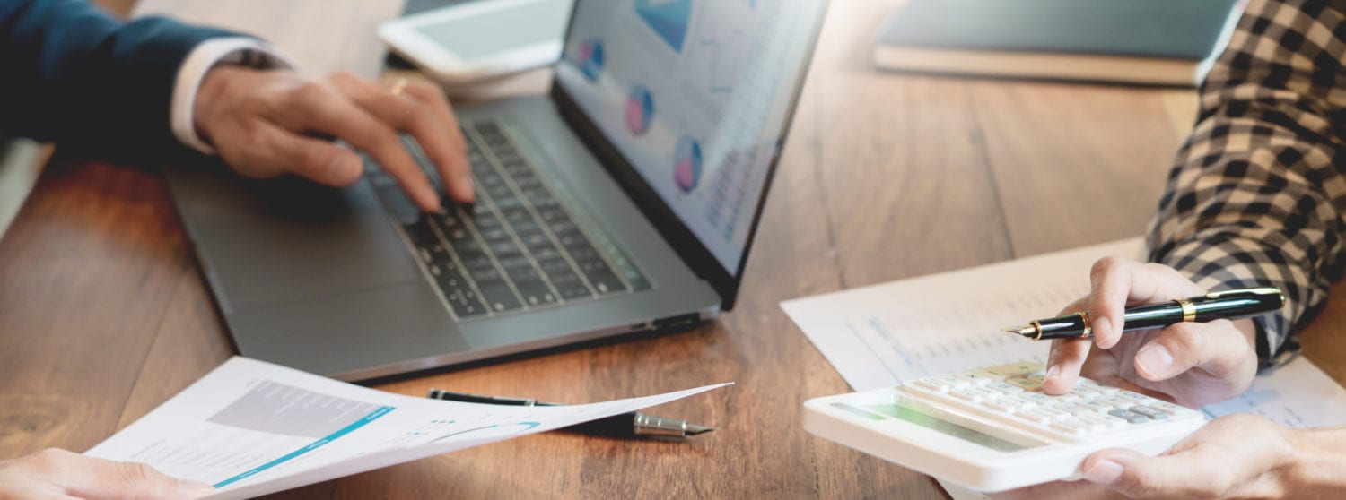 Business owner sitting with tax consultant