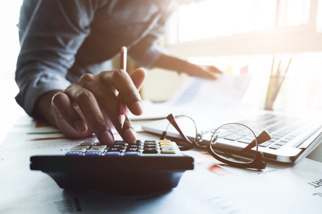 professional-services-body man using calculator