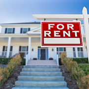 For sale sign yellow house